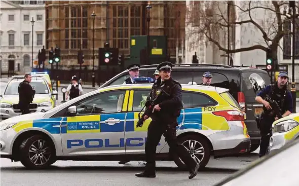  ?? REUTERS PIC ?? Police outside Parliament during an incident on Westminste­r Bridge in London on Wednesday.