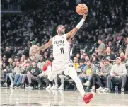  ?? USA TODAY SPORTS ?? The Nets’ Kyrie
Irving catches a pass during the game against the Grizzlies.