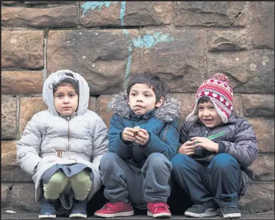  ??  ?? Children during their lunch break at play in the playground of Annette Street Primary School in Govanhill