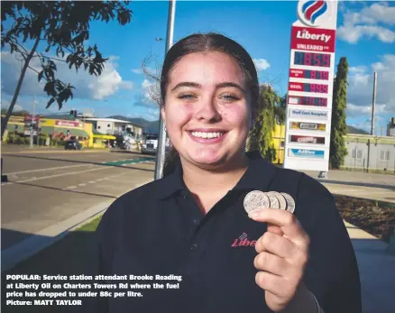  ??  ?? POPULAR: Service station attendant Brooke Reading at Liberty Oil on Charters Towers Rd where the fuel price has dropped to under 88c per litre.
Picture: MATT TAYLOR