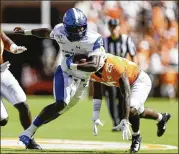  ?? SILAS WALKER / GETTY IMAGES ?? Georgia State’s Dan Ellington runs against Tennessee on the way to the Sun Belt Conference Panthers’ stunner in Knoxville.