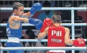  ??  ?? Amit Panghal (in blue) in action during the 49kg semifinal.