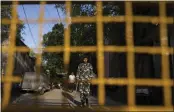  ?? ALTAF QADRI — THE ASSOCIATED PRESS ?? A security person stands guard outside the office of Delhi Police's Special Cell in New Delhi, India, Tuesday.