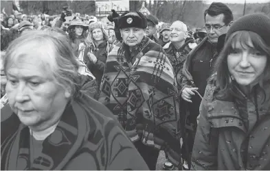  ?? DARRYL DYCK / THE CANADIAN PRESS ?? Grand Chief Stewart Phillip, centre right, has warned that allowing the Trans Mountain project to proceed “could mean going back to one of the darkest times in modern Canadian history” — the Oka standoff in 1990.