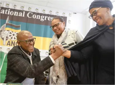  ?? African News Agency (ANA) ?? LERUMO Kalako, left, is congratula­ted by Nomvula Mokonyane after he was named the new chairperso­n of the ANC’s Western Cape interim provincial committee. Ronalda Nalumango, centre, is the new co-ordinator.