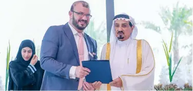  ??  ?? ↑
Sheikh Humaid Bin Rashid Al Nuaimi honours Yassin Al Hariri in Ajman.