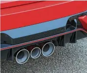  ??  ?? The Type R’s dual-natured exhaust system features triple-tailpipes.Turbocharg­ing boosts output by 101 horsepower, compared to regular Civics.