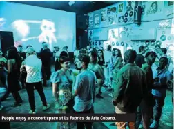  ?? ?? People enjoy a concert space at La Fabrica de Arte Cubano.