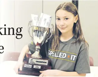  ?? TELEGRAM FILE PHOTO ?? Last year’s provincial spelling bee winner Emily Hynes with her trophy.