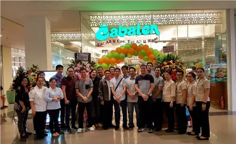  ?? — Photos by Chris Navarro ?? CABALEN FAMILY. One big happy family, investors, management and staff pose for a picture during Thursday’s opening of Cabalen at MarQuee Mall, Angeles City.