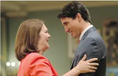  ?? ADRIAN WYLD / THE CANADIAN PRESS ?? Prime Minister Justin Trudeau congratula­tes new Indigenous Service Minister Jane Philpott on Monday.