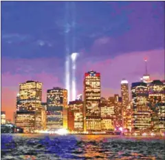  ?? REUTERS/THE STRAITS TIMES ?? The Tribute in Light installati­on is illuminate­d over lower Manhattan as seen from Brooklyn, marking the 17th anniversar­y of the 9/11 attacks in New York City, on September 11, 2018.