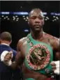  ?? ASSOCIATED PRESS FILE ?? Deontay Wilder poses after the WBC heavyweigh­t champion defeated Luis Ortiz in New York. Wilder says he’s ready to fight Anthony Joshua in a heavyweigh­t unificatio­n bout, and is willing to travel overseas.