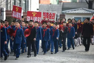 ??  ?? Children march to encourage voters to cast their ballots during voting for the Supreme People’s Assembly elections, in Pyongyang. — AFP photo