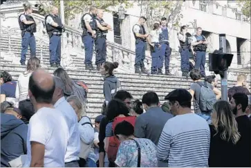  ?? Photograph­s by Claude Paris Associated Press ?? POLICE block access to St. Charles train station in Marseille, France, after a deadly knifing attack. The incident took place weeks after a woman doused four U.S. college students with acid at the same station.