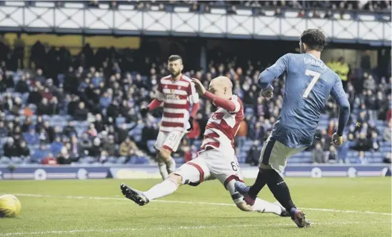  ??  ?? 2 Joe Garner scores the second goal of his hat-trick during Rangers’ 6-0 demolition of Hamilton Accies at Ibrox on Saturday.