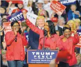  ?? TRIBUNE CONTENT AGENCY ?? Omarosa Manigault-Newman, seen with President Donald Trump in 2016, is waging a public relations war against her former boss.