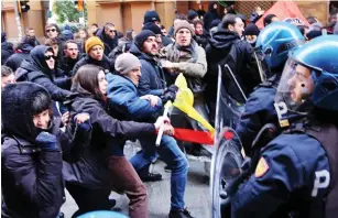  ??  ?? Clash: Anti far-Right protesters and police in Italy in February