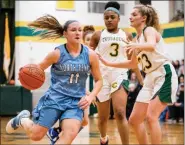  ?? JAMES BEAVER/FOR MEDIANEWS GROUP ?? North Penn’s Alli Lindsay (11) drives the lane on her way to another Knights basket during their game against Lansdale Catholic.