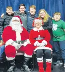  ?? HOPE BRIDGEWATE­R PHOTO ?? Several Wentworth teen club members pose with Santa Claus and Mrs. Claus, including back, from left, Nathan Rushton, Travis Reid, Morgan Patriquin, Jenna Laird and Grady Rushton.