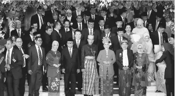  ??  ?? Widodo (centre) and his wife Iriana pose for pictures with parliament members after delivering a speech in front of parliament members ahead Independen­ce Day celebratio­ns in Jakarta, Indonesia. — Reuters photo