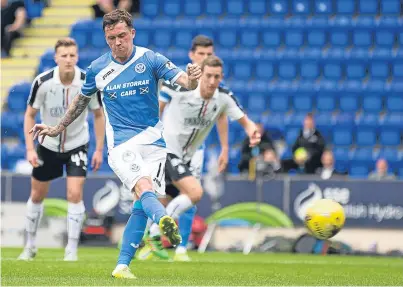  ?? Picture: Perthshire Picture Agency. ?? Danny Swanson makes it 2-0 from the penalty spot.