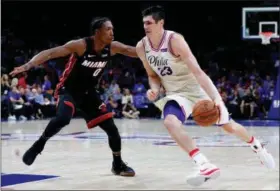  ?? CHRIS SZAGOLA — THE ASSOCIATED PRESS FILE ?? The Philadelph­ia 76ers’ Ersan Ilyasova, right, drives against the Miami Heat’s Josh Richardson during their playoff series.