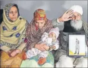  ??  ?? ■ Head constable Sukhjinder Singh’s parents along with his wife Sarabjit Kaur and eight-month-old son at Gandiwind Dhattal village in Tarn Taran’s Patti subdivisio­n on Saturday. SAMEER SEHGAL/HT