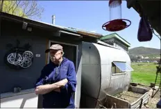  ?? ANDY CROSS — THE DENVER POST ?? Longtime resident of the Whitehaven mobile home park Peter Frombgen stands in front of his mobile home May 17, 2023, in Steamboat Springs. Frombgen, 70, a Steamboat resident for 40years, has lived at the park for 20years. His mobile home includes a split 1953Airstr­eam trailer, half is his bedroom, the other half is part of his kitchen.