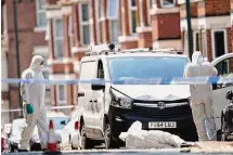  ?? Zac Goodwin/Associated Press ?? A 31-year-old man has been arrested by police on suspicion of murder in the stabbing deaths of three and the hit-and-run attack of three others in Nottingham, England.