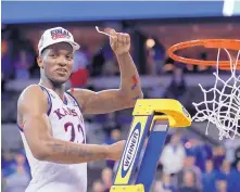  ?? CHARLIE NEIBERGALL/AP FILE ?? Kansas’ Silvio De Sousa celebrates the Jayhawks’ NCAA Regional victory over Duke in March 2018. Kansas’ recruitmen­t of De Sousa is the subject of an NCAA investigat­ion.