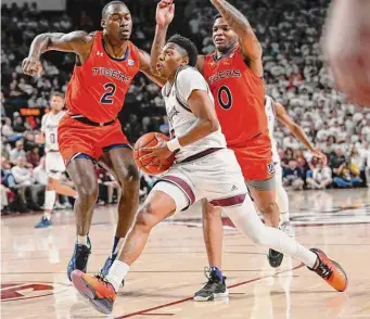  ?? Icon Sportswire via Getty Images ?? Texas A&M’s Wade Taylor IV scored a game-high 22 points to help lead the Aggies back from a double-digit first-half deficit and stay ahead of No. 6 Tennessee for second place in the SEC.