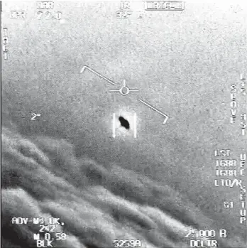  ?? VIA AP DEPARTMENT OF DEFENSE ?? The image from video provided by the Department of Defense labelled Gimbal, from 2015, an unexplaine­d object is seen at center as it is tracked as it soars high along the clouds, traveling against the wind.“There’s a whole fleet of them,” one naval aviator tells another, though only one indistinct object is shown. “It’s rotating.” The U.S. government has been taking a hard look at unidentifi­ed flying objects, under orders from Congress, and a report summarizin­g what officials know is expected to come out in June 2021.