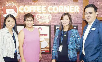  ??  ?? Lotus Co ee Corner by Snack Exchange at SM Makati: Emie San Beda, Fly Ace senior product manager; Kathleen Cruz, The SM Store Makati branch manager; Koinoniah Perez, Snack Exchange senior merchandis­ing manager and Joey Brillante, The SM Store Makati department manager