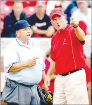  ?? FILE PHOTO NWA DEMOCRAT-GAZETTE ?? Farmington head coach Randy Osnes argues a call at home plate with an umpire during the sixth inning against Ashdown during the 4A state championsh­ip at Bogle Park in Fayettevil­le on Friday, May 20, 2011. Osnes achieved his 500th career victory in 2017.