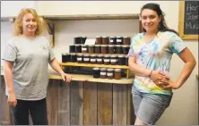  ??  ?? Anita Barden, left, and her daughter, Cara Donovan, are partners in the new Two Farms Market on Main Street in Winsted.