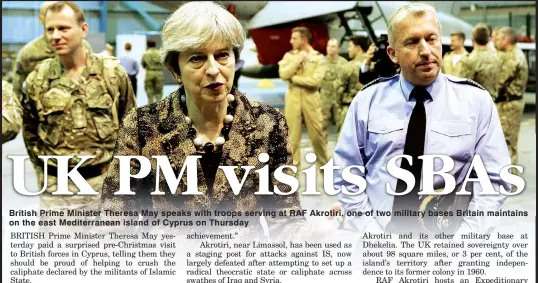  ??  ?? British Prime Minister Theresa May speaks with troops serving at RAF Akrotiri, one of two military bases Britain maintains on the east Mediterran­ean island of Cyprus on Thursday