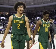  ?? AP file PHotos ?? SMILING: Baylor guard Kendall Brown, left, smiles as he, forward Jonathan Tchamwa Tchatchoua, center back, and guard Adam Flagler, right, walk off the floor after defeating TCU in Fort Worth, Texas, on Saturday.