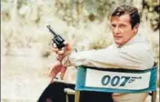  ??  ?? Roger Moore, playing the title role of secret service agent James Bond, at the sets of Live and Let Die in 1972. AP FILE