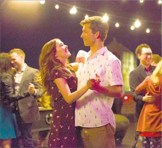  ??  ?? ZOEY DEUTCH with Glen Powell in “Set It Up,” a film first set up at MGM. But after Emilia Clarke dropped out of the role Deutch was later cast in, the studio dumped the project. Then Netflix swooped in.