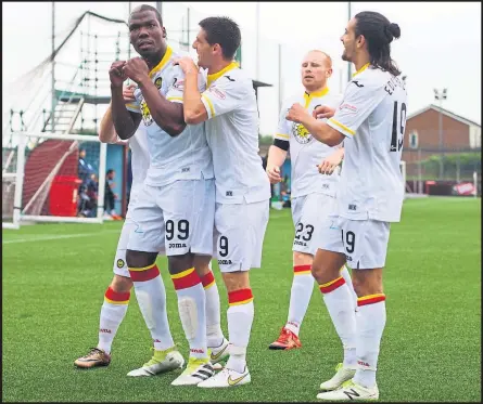  ??  ?? Firhill striker Mathias Pogba celebrates with his Partick Thistle team-mates after notching the opener on the way to a 4-1 victory