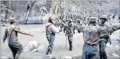  ?? —AFP ?? The video grab taken from footage recorded in mid-June 2020 and released by China Central TV on Jan 20, 2021 shows Chinese (foreground) and Indian soldiers (R, background) during an incident where troops from both the countries clashed in the Galwan Valley.