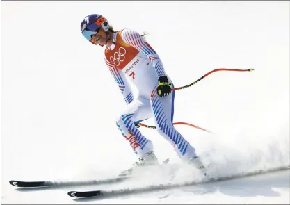  ?? CHARLIE RIEDEL — THE ASSOCIATED PRESS ?? The United States’ Lindsey Vonn finishes what is likely her final Olympic downhill run after winning the bronze medal at the 2018 Winter Olympics in Jeongseon, South Korea. Italy’s Sofia Goggia won the gold, and Norway’s Ragnhild Mowinckel won the...