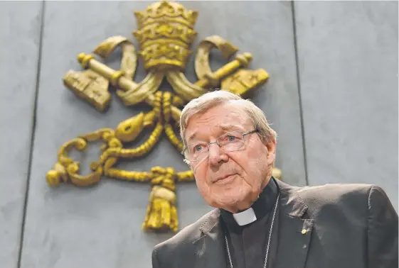  ?? Picture: AFP ?? Cardinal George Pell looks on as he makes a statement in the Vatican City. He says will return to Australia to face sex abuse charges.