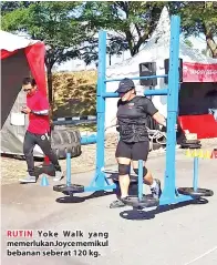  ??  ?? RUTIN Yoke Walk yang memerlukan­Joycememik­ul bebanan seberat 120 kg.