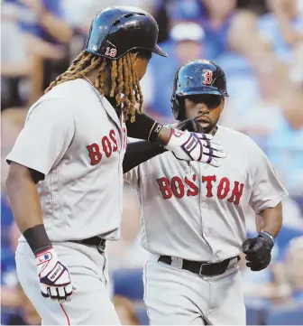  ?? AP PHOTO ?? BRIGHT SPOT: Jackie Bradley Jr. celebrates with Hanley Ramirez after hitting a tworun homer during the Sox’ 4-2 loss to the Royals last night in Kansas City, Mo.