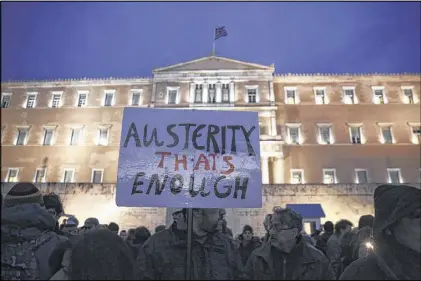  ??  ?? Pro-government protesters gather Wednesday in front of Greece’s parliament to back its demands of a bailout debt renegotiat­ion. The protests held in Athens and several other European cities occurred as the new Greek government presented its proposals...