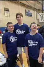  ?? OWEN MCCUE - MEDIANEWS GROUP ?? Spring-Ford senior boys basketball player Patrick Kovaleski, center, takes a picture with Shooting Stars players Dylan Nowakowski, left, and Jacob Strohl on Dec. 14.