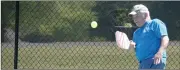  ?? ?? Jim Reynolds leans into a return during his pickleball match Sunday at Metfield Park.