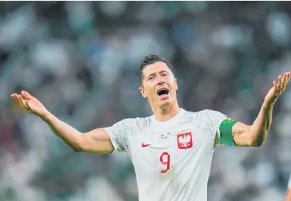  ?? Photo / AP ?? Are you not entertaine­d? Lewandowsk­i celebrates scoring in Poland’s 2-0 win over Saudi Arabia.